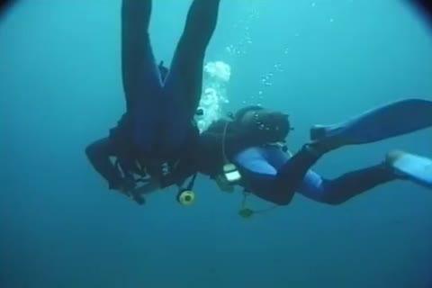 Male Divers Go Down On Each Otthellos manr By Tthellos man Ocean.