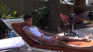 GayAsianNetwork - Levy Foxx wearing trunks stretching outdoors