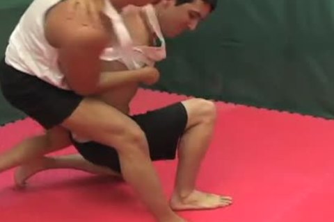 Wrestlers fight & blow each other in the ring